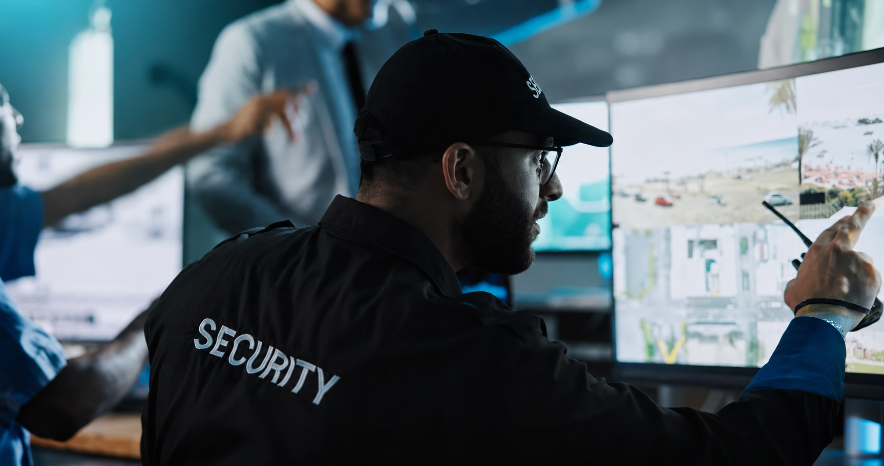 MeridianSecurity operator monitoring live surveillance feeds in a control room